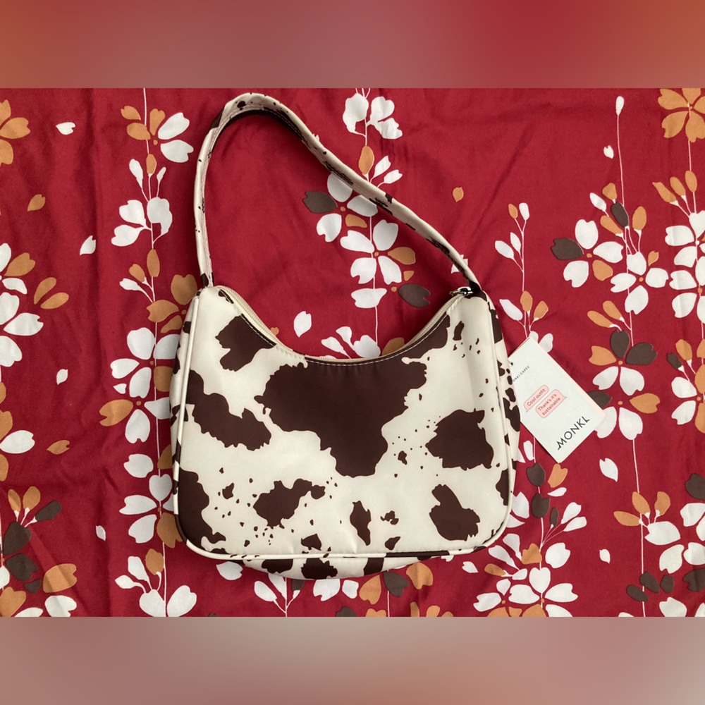 Monki Hilma recycled shoulder bag in cow print